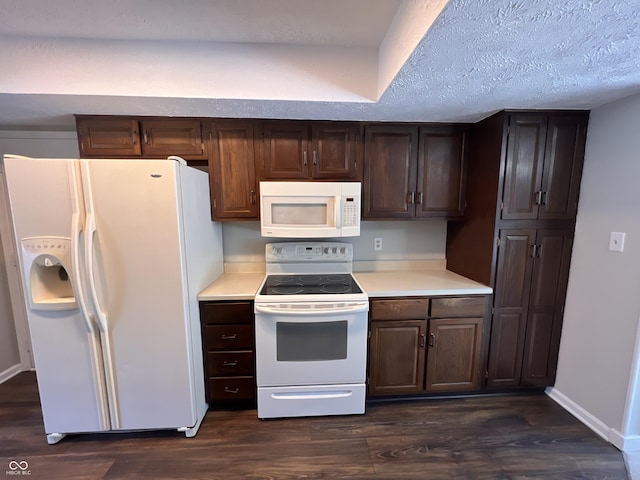 kitchen featuring white appliances, dark brown cabinets, a textured ceiling, and dark wood-type flooring