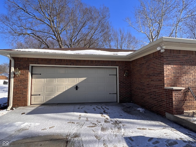 view of snow covered garage