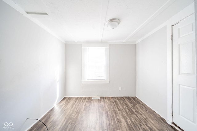 unfurnished room with hardwood / wood-style flooring