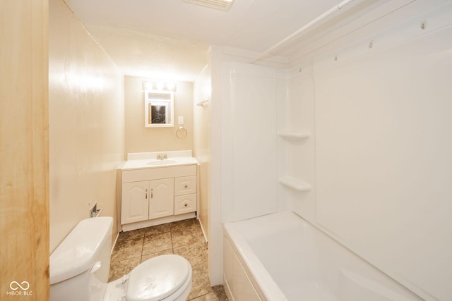 bathroom with vanity, a shower, and toilet