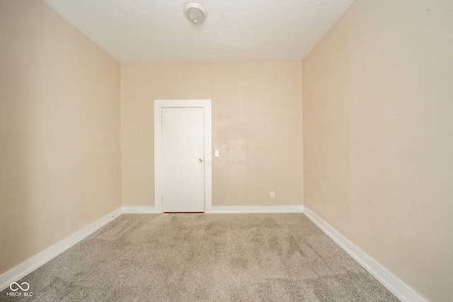 unfurnished room with carpet floors