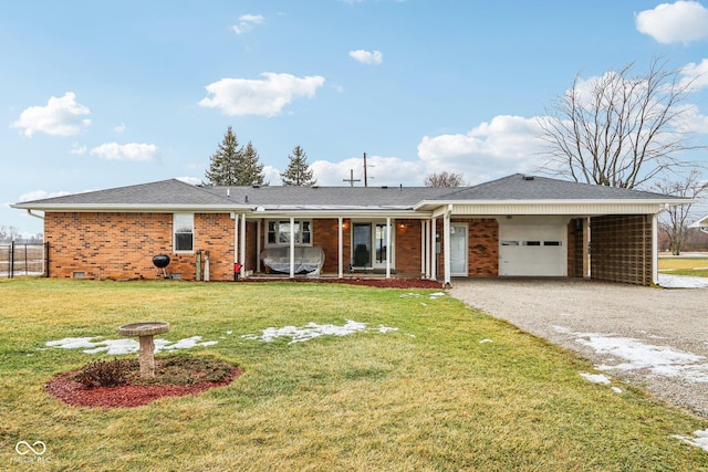 ranch-style home with a garage and a front lawn