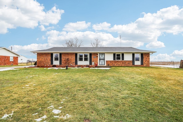 single story home featuring a front yard