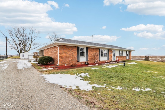 ranch-style home with a front yard