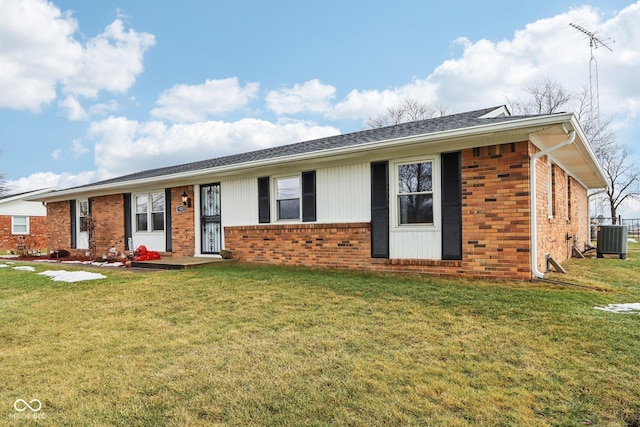 single story home featuring central AC unit and a front yard