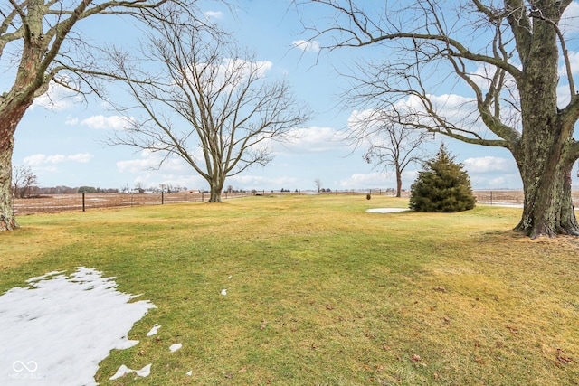 view of yard with a rural view