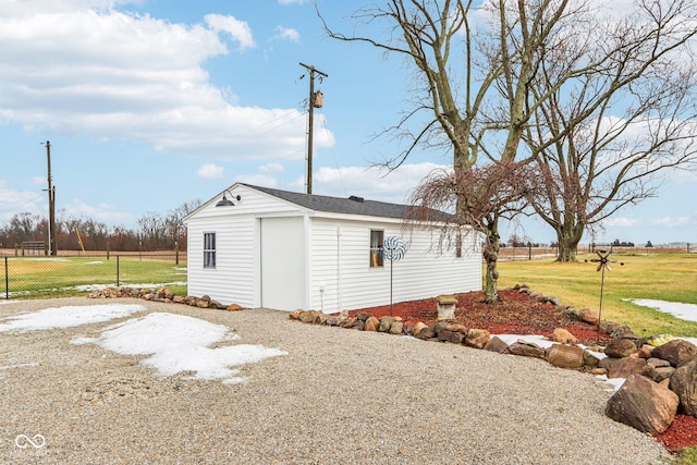 view of outdoor structure featuring a lawn