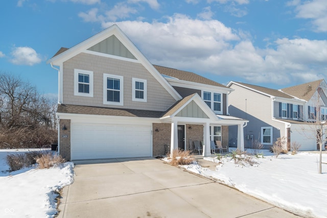 view of front of property featuring a garage and covered porch