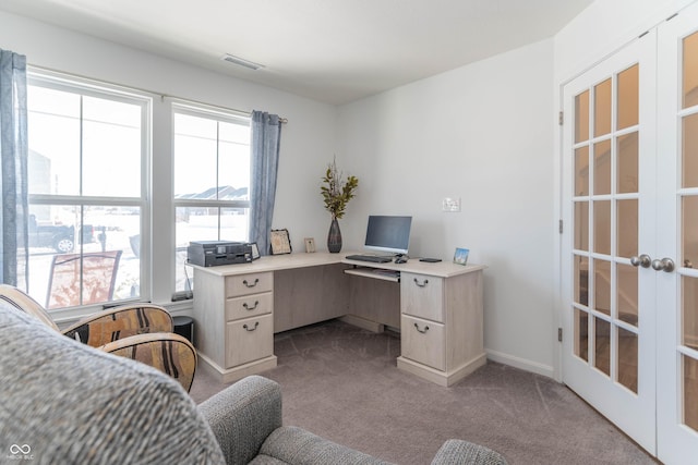 carpeted office featuring french doors