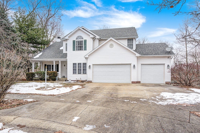 view of property featuring a garage and covered porch