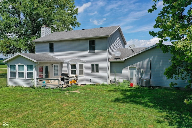 5378 E County Road 600 S, Walton, IN 46994 - rear view of property featuring a chimney, a lawn, a wooden deck, and roof with shingles