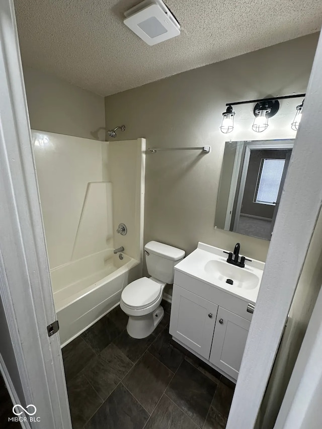 full bathroom with vanity, toilet, a textured ceiling, and shower / bathing tub combination