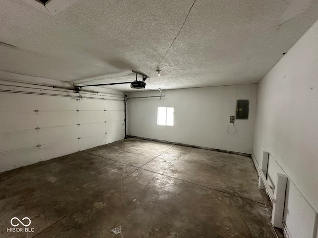 garage featuring a garage door opener and electric panel