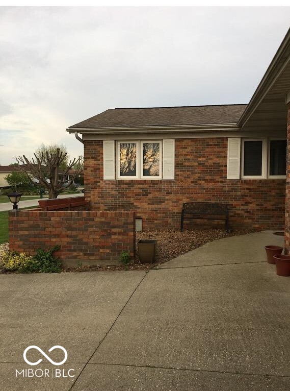 view of side of home featuring a patio