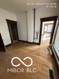 empty room featuring wood-type flooring