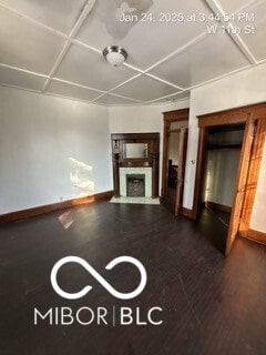 unfurnished living room with hardwood / wood-style flooring