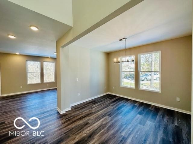 interior space featuring dark hardwood / wood-style floors and a chandelier