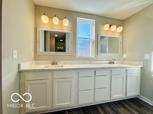 bathroom featuring hardwood / wood-style flooring and vanity