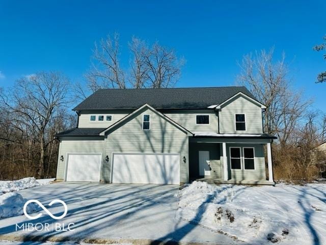 front facade with a garage and covered porch