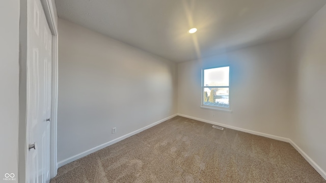 view of carpeted spare room