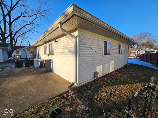 view of side of home with a patio area