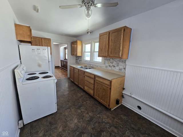 kitchen with ceiling fan, white appliances, and sink