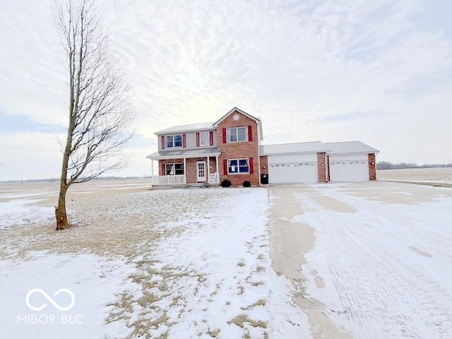 view of front of house featuring a porch and a garage