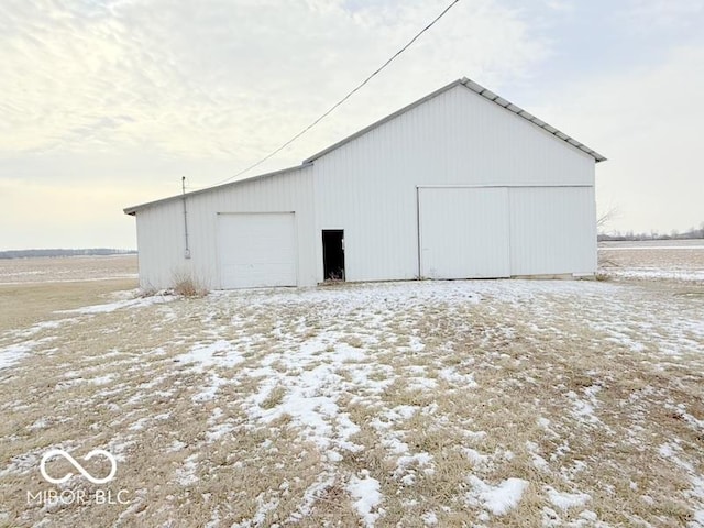 view of snow covered garage