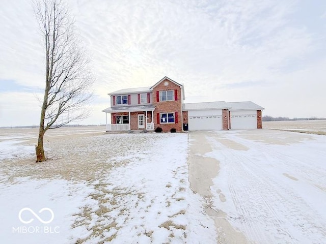 view of front of house with a garage and covered porch