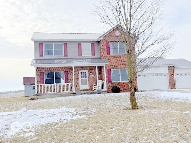 view of front of property featuring a garage and a porch