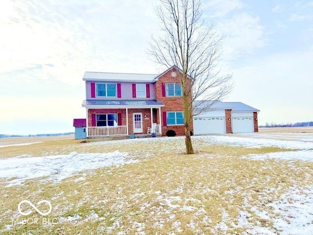 view of front of house with a porch and a garage