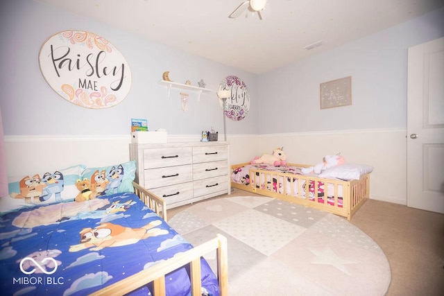 bedroom with light colored carpet and ceiling fan