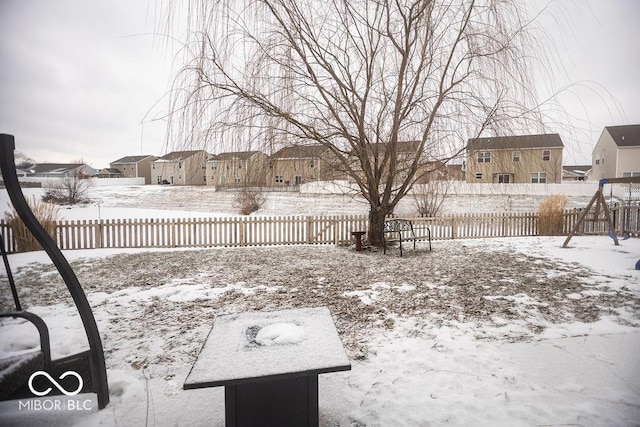 view of yard covered in snow