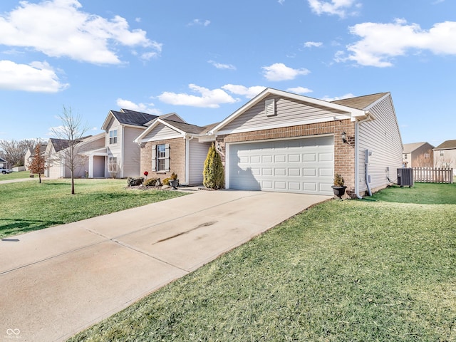 ranch-style house with a garage, a front lawn, and central air condition unit