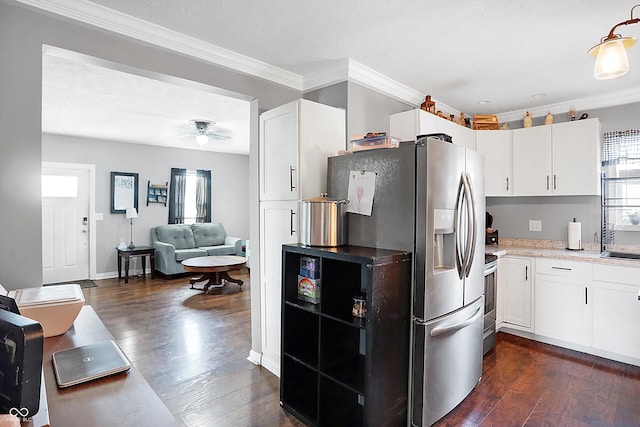 kitchen featuring stainless steel appliances, dark hardwood / wood-style floors, and white cabinets