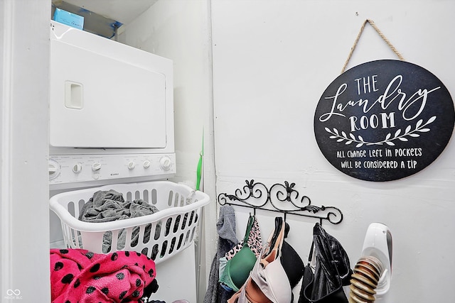 interior space featuring stacked washer / dryer