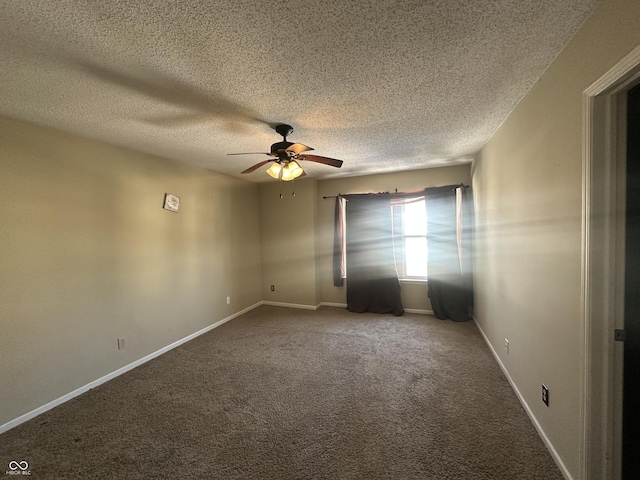 spare room with ceiling fan, carpet floors, and a textured ceiling