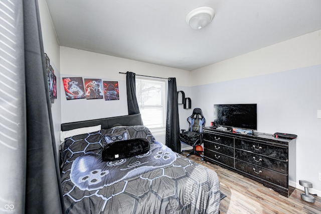bedroom featuring wood-type flooring