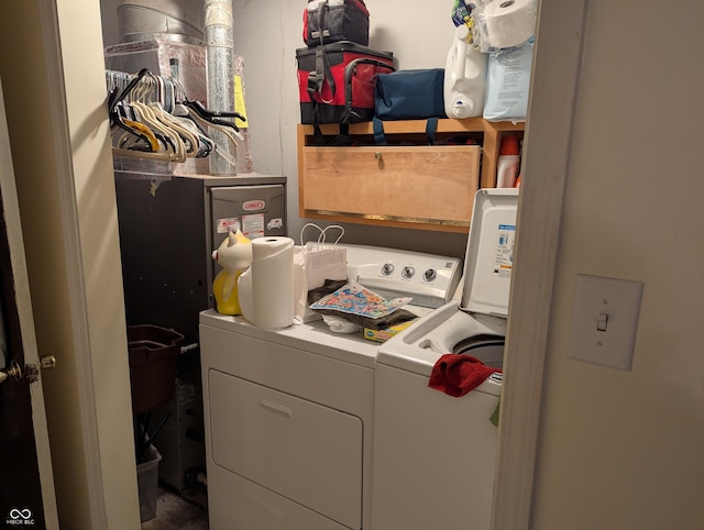 laundry area with independent washer and dryer