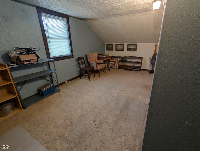 bonus room with lofted ceiling, carpet flooring, and a textured ceiling