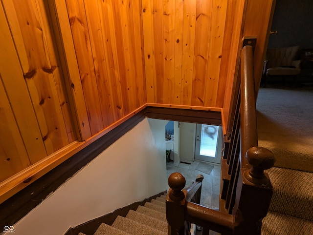 stairs with wood walls