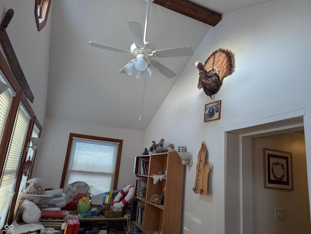 interior space with ceiling fan, beam ceiling, and high vaulted ceiling