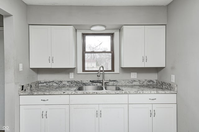 kitchen with sink and white cabinets