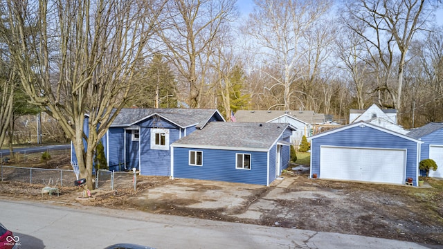 view of front of house featuring a garage and an outdoor structure