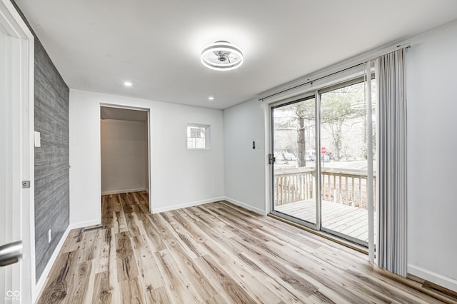 empty room with light hardwood / wood-style floors