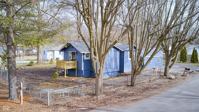 view of front of property featuring a wooden deck