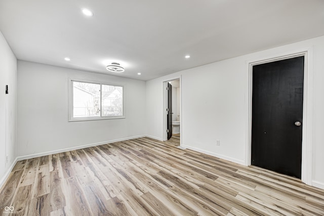 unfurnished room with light hardwood / wood-style floors