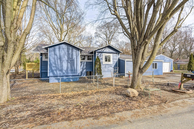 view of front facade with a garage and an outdoor structure