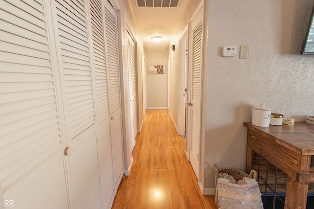 hallway featuring light hardwood / wood-style floors