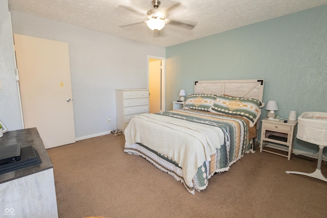 carpeted bedroom featuring ceiling fan and a textured ceiling